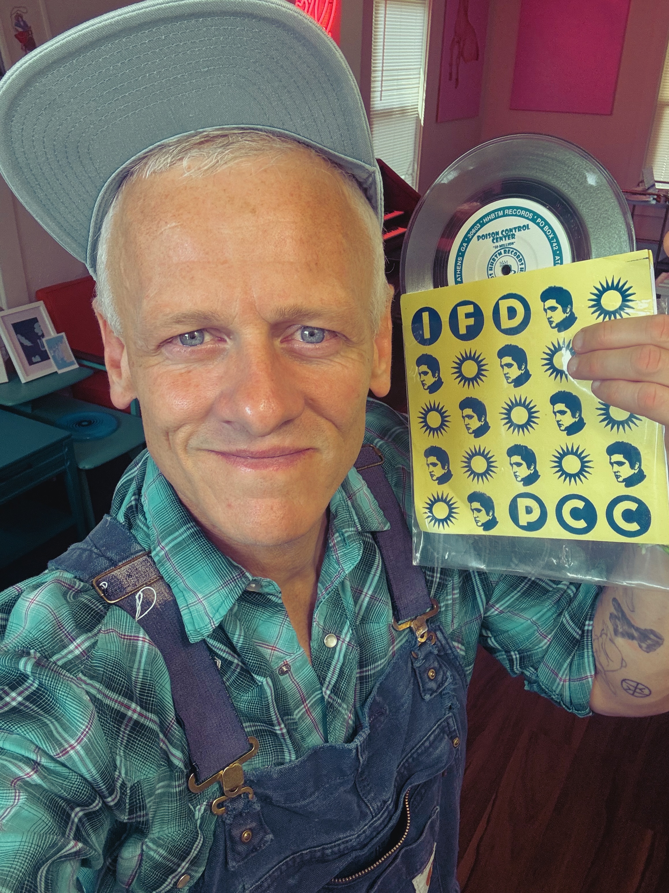 Patrick Tape Fleming holding a split 7inch record happy happy birthday to me records