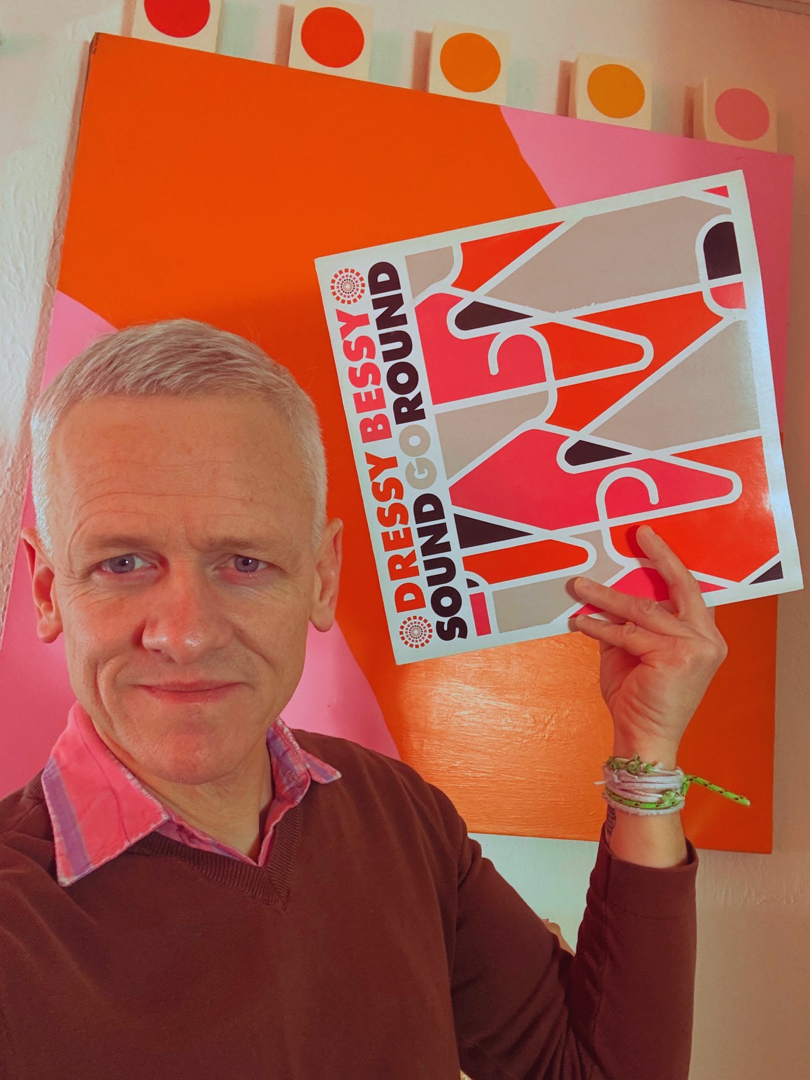 Patrick Tape Fleming holding Sound Go Round By Dressy Bessy Vinyl Record Pink Orange
