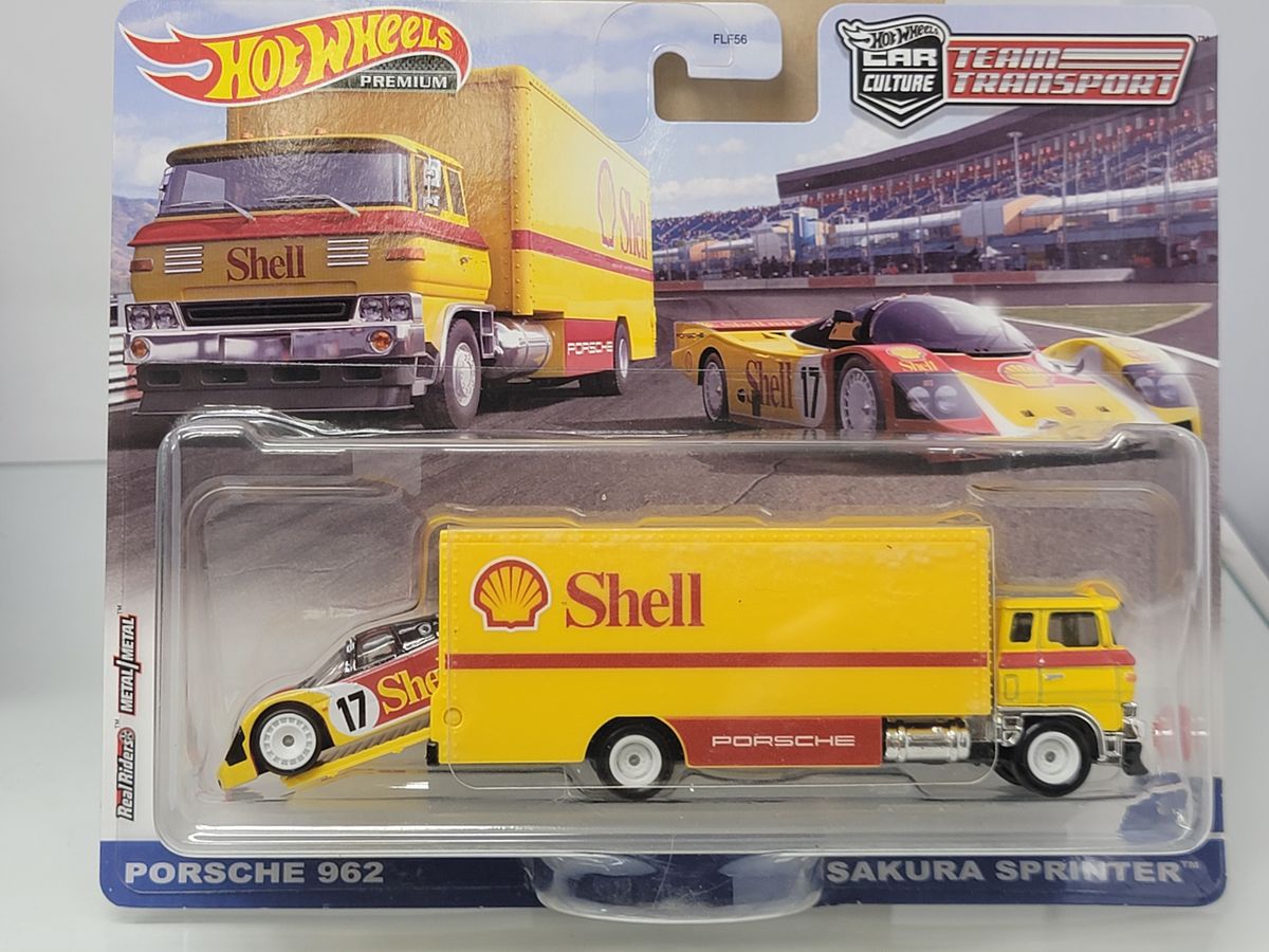 HOT WHEELS PREMIUM TEAM TRANSPORT – PORSCHE 962 & SAKURA SPRINTER – SHELL RACING LIVERY – SEALED