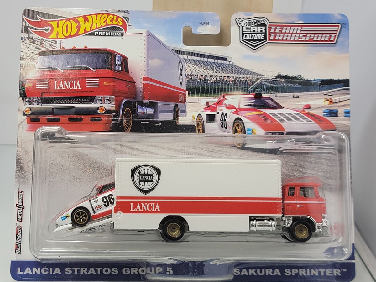 HOT WHEELS PREMIUM TEAM TRANSPORT – LANCIA STRATOS GROUP 5 & SAKURA SPRINTER – RED/WHITE LIVERY – SEALED