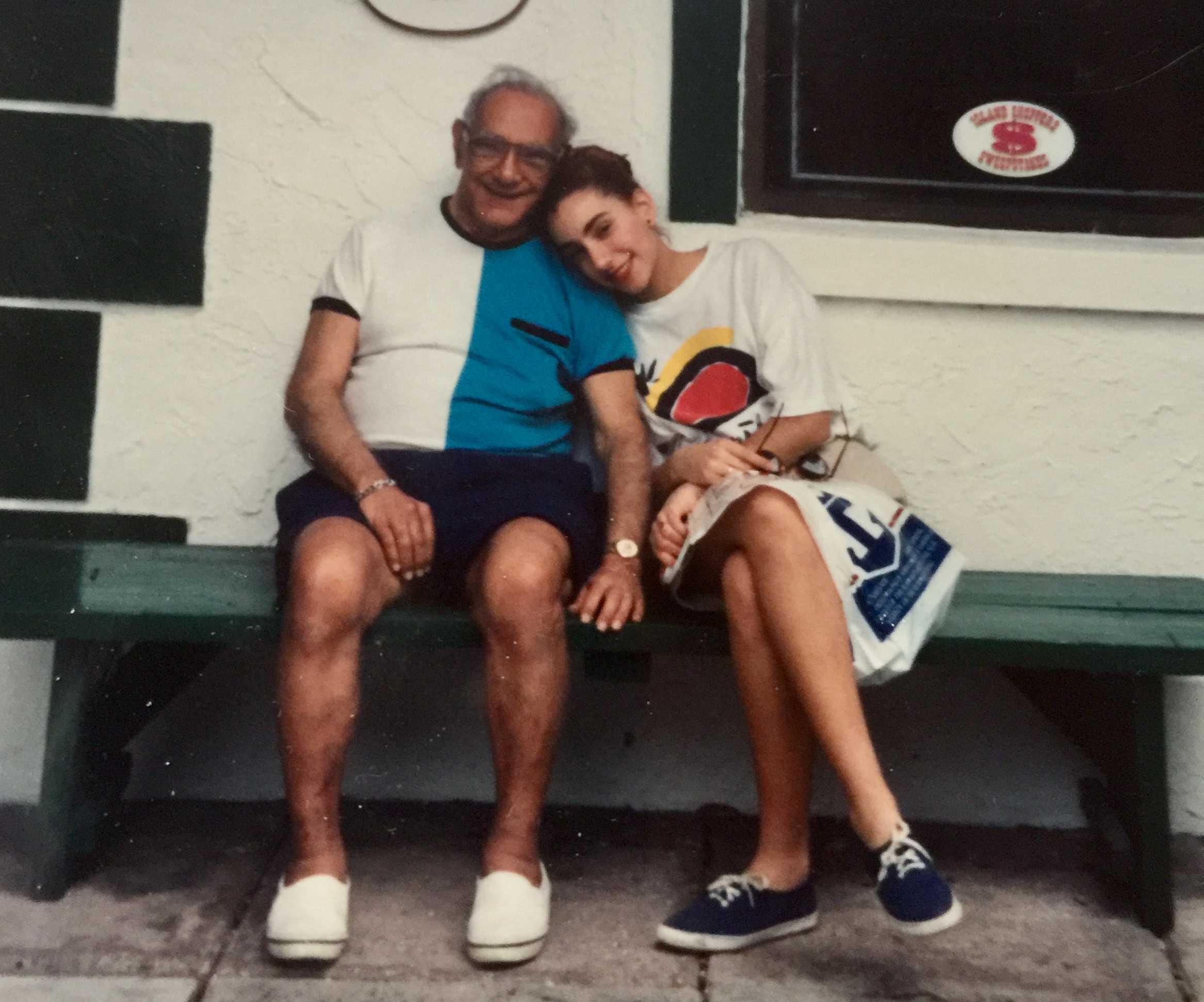 George in his late 70s with Laura in her teens leaning her head against his shoulder. Just sitting outside the shops at Ocean City, NJ