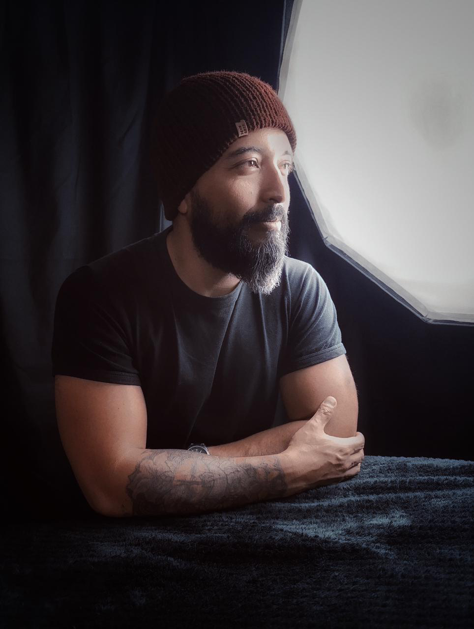 Carlos Maya portrait beside the studio window
