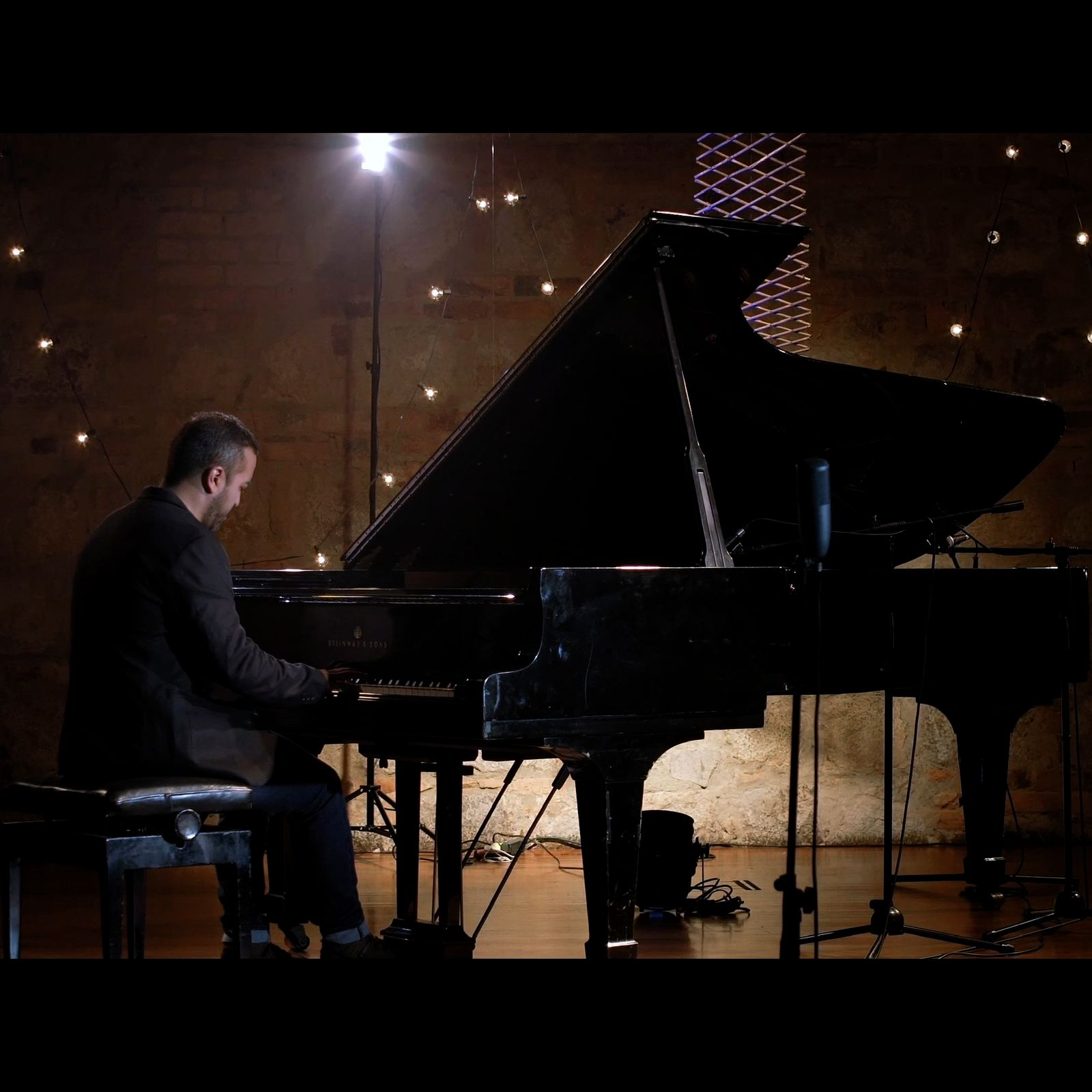 Carlos Maya performing at a grand piano