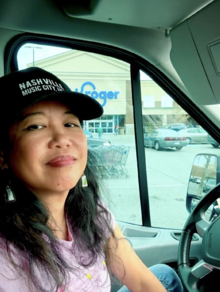 Silvia Passiflora Southern Gothic Folk poet-songwriter in a parking lot