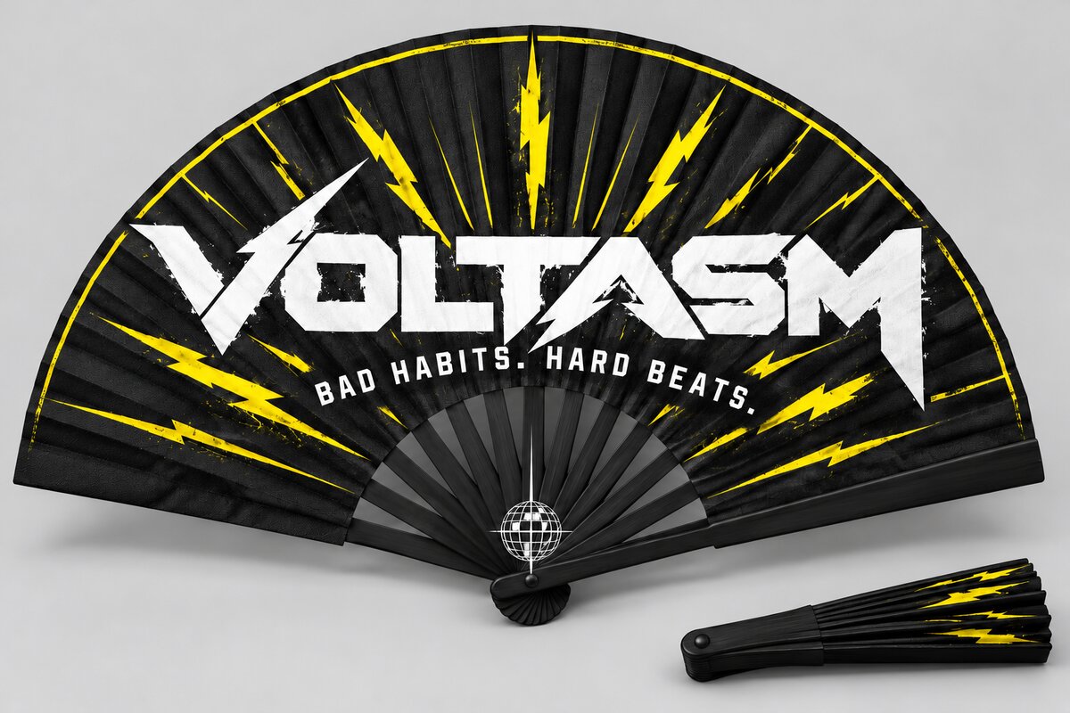 VOLTASM Festival Fan: The VOLTASM wordmark and electric yellow lightning across a black folding fan.
