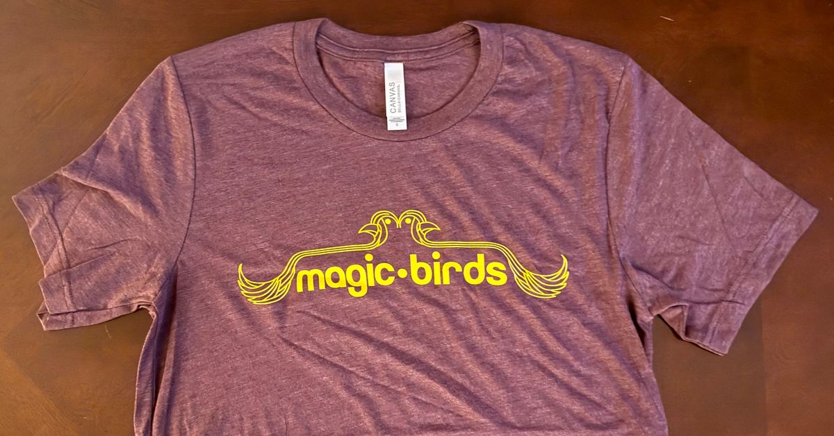 Magic Birds Logo on Maroon T-Shirt