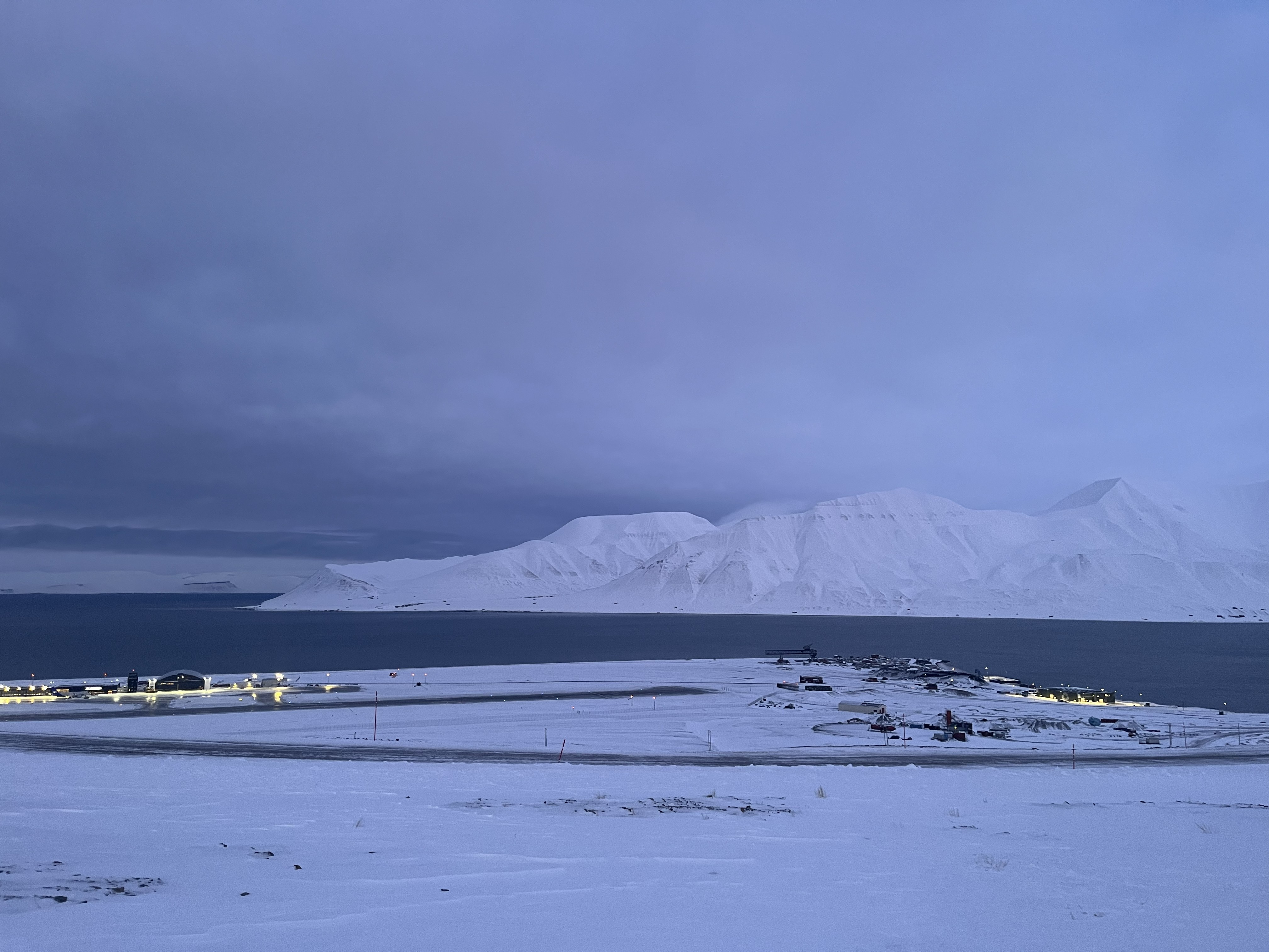Returning February light over Longyearbyen, Svalbard, as the town emerges from Polar Night