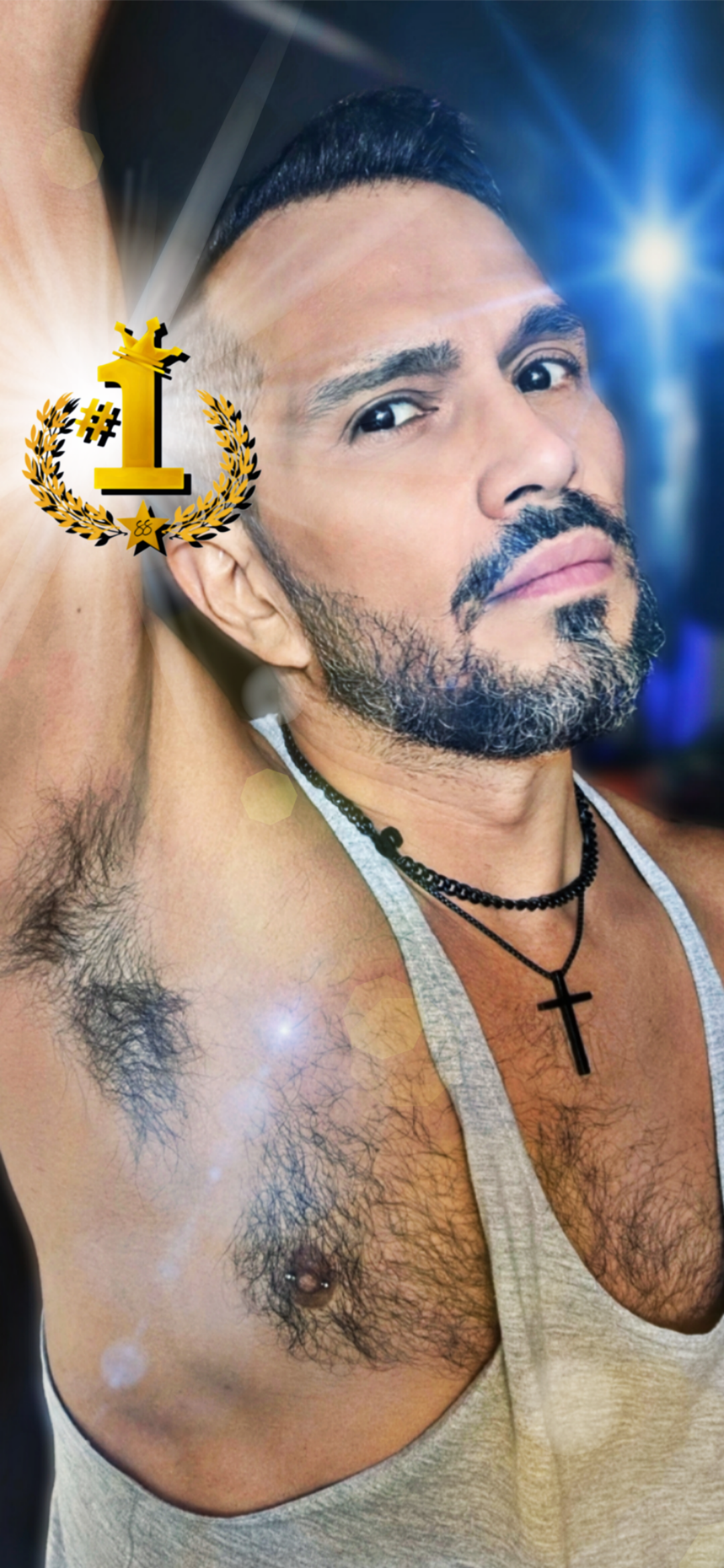 The World’s No.1 Superstar® shows his left nipple piercing, a body modification commemorating his trip to Athens, Greece.