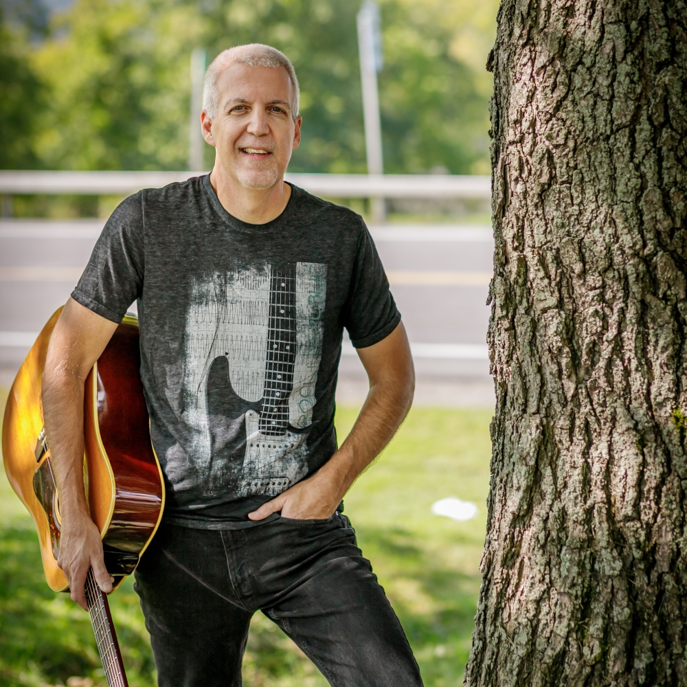 Mike Lucey Next to a Tree