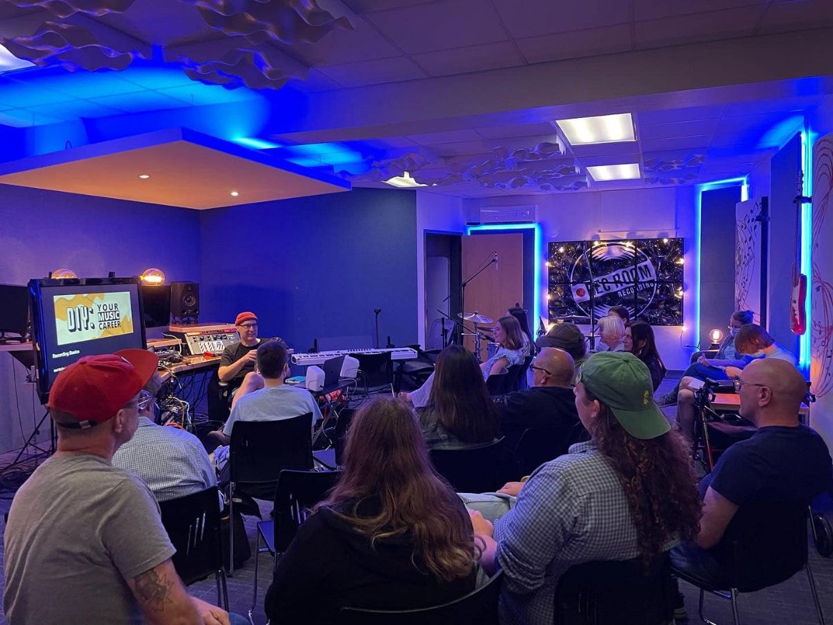 Neil McTavish speaks to the crowd at REC Room Recording Studio