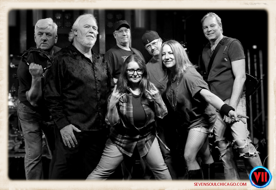 Full band showing Laurie front-and-center