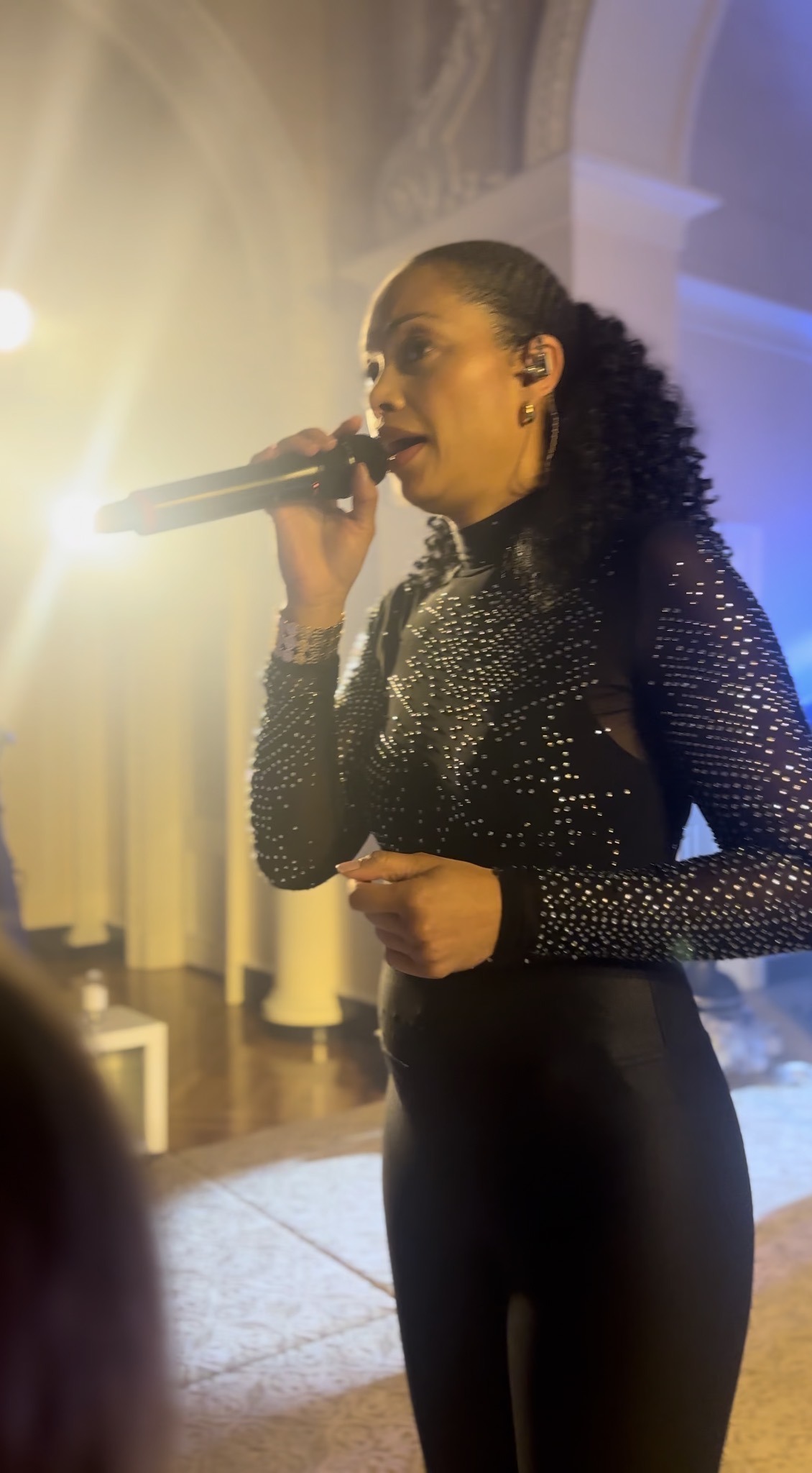 Perfect 10 Band co-bandleader Leslie performing live vocals on stage at the Atlanta History Center