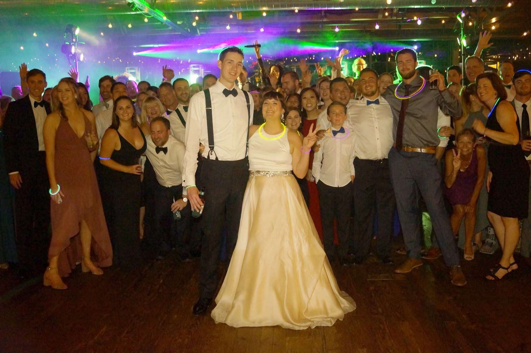 Perfect 10 Band packed dance floor with bride and groom at Summerour Studio
