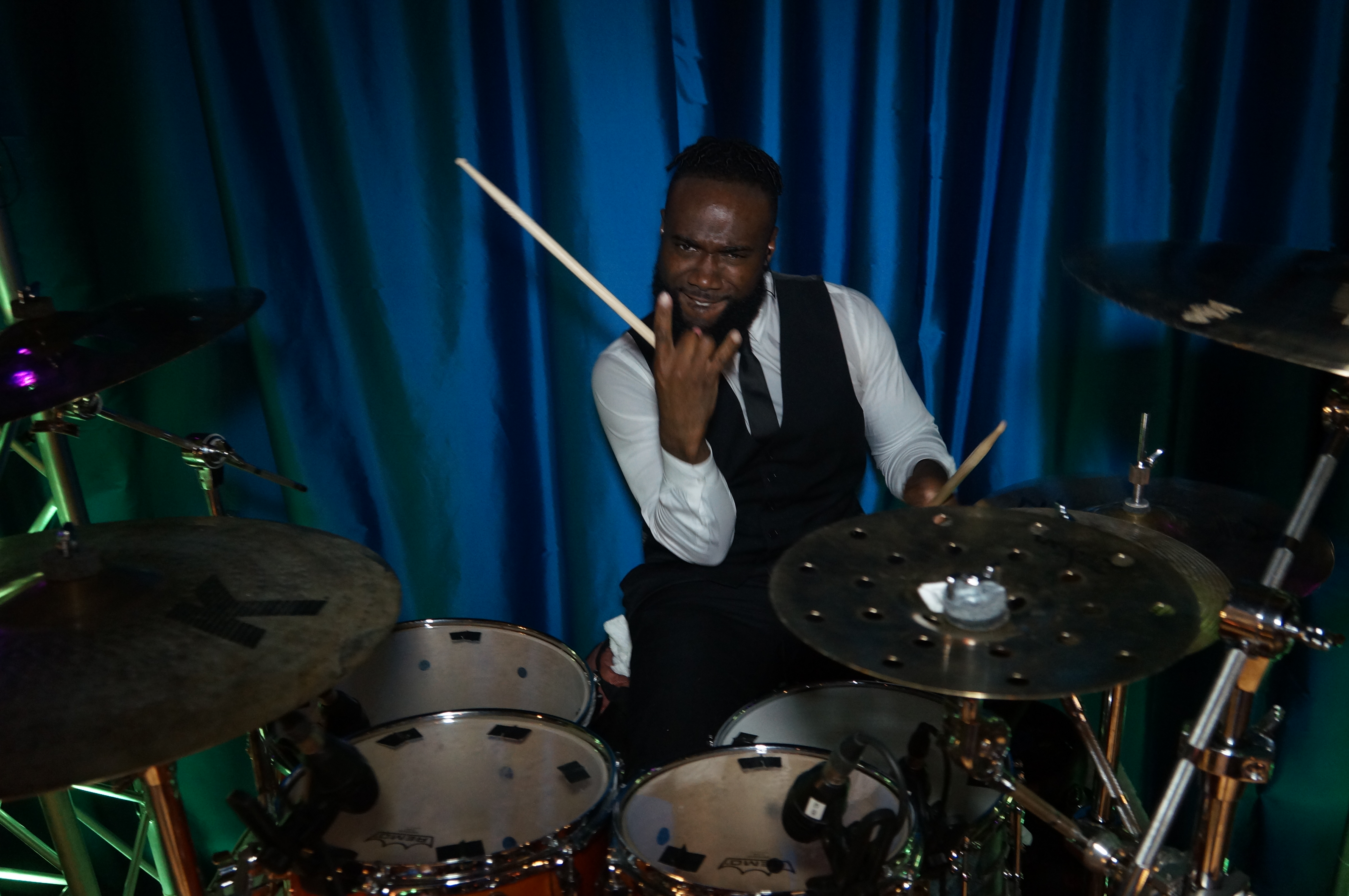 Live party band drummer, Macston, performing behind the kit at an Atlanta wedding reception.
