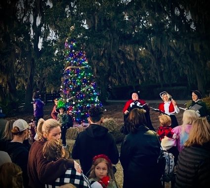 Christmas carolers performing for a community audience