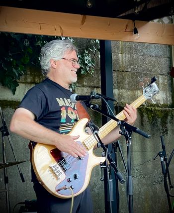 Playing bass at my 60th birthday bash in 2023.
