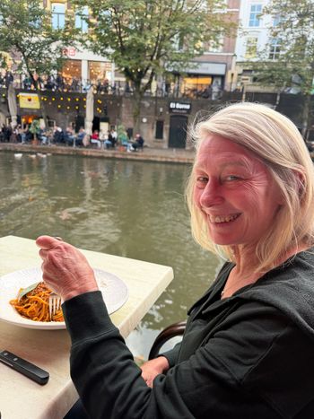 Debbie at a table beside the canal. Lunch with scenery included.
