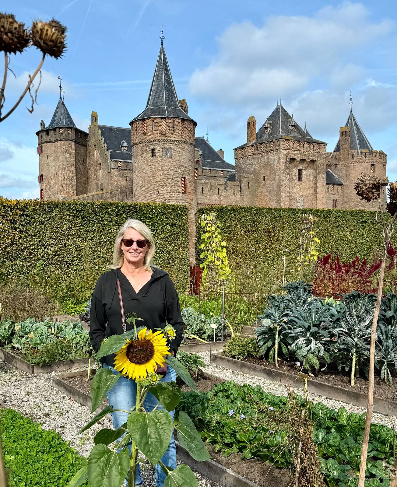 Debbie among the sunflowers at Muiderslot Castle in Muiden.