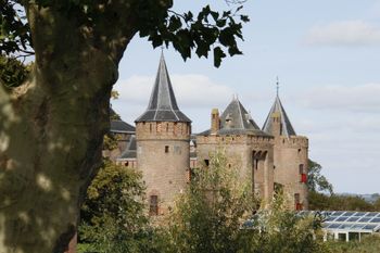 Muiderslot Castle, Muiden. Castle towers through the branches. Another angle, another photograph.
