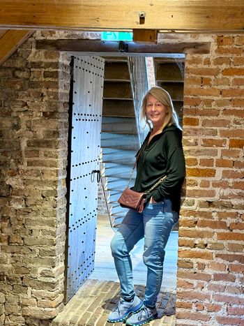 Muiderslot Castle, Muiden. Debbie in a centuries-old doorway. My favorite part of this view is her smile.
