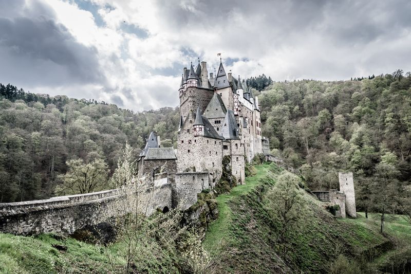 A German castle nestled among forested hills