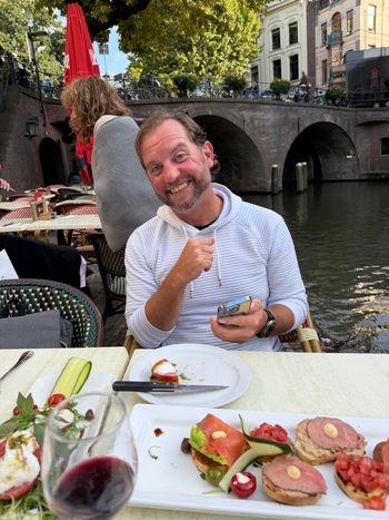 Chad at our canalside table in Utrecht. A dinner with an unexpected story. Photo by Debbie.
