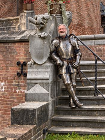 Sir Bill, courtesy of AI. I suspect that suit of armor would complicate playing the guitar.
