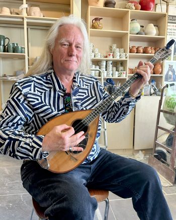 Learning to play the bazooki in Panaretos Ceramic Art (Corfu Greece 2025)
