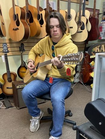 Strumming twelve at the Music Shoppe in Pagosa Springs, CO
