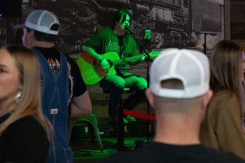 singing live country music to a lively crowd in Denton County
