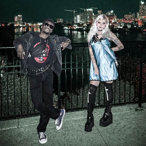 Ben & Jazz of Ottawa-based band Fifteen Seconds of Fish pose at night in Major Hill Park