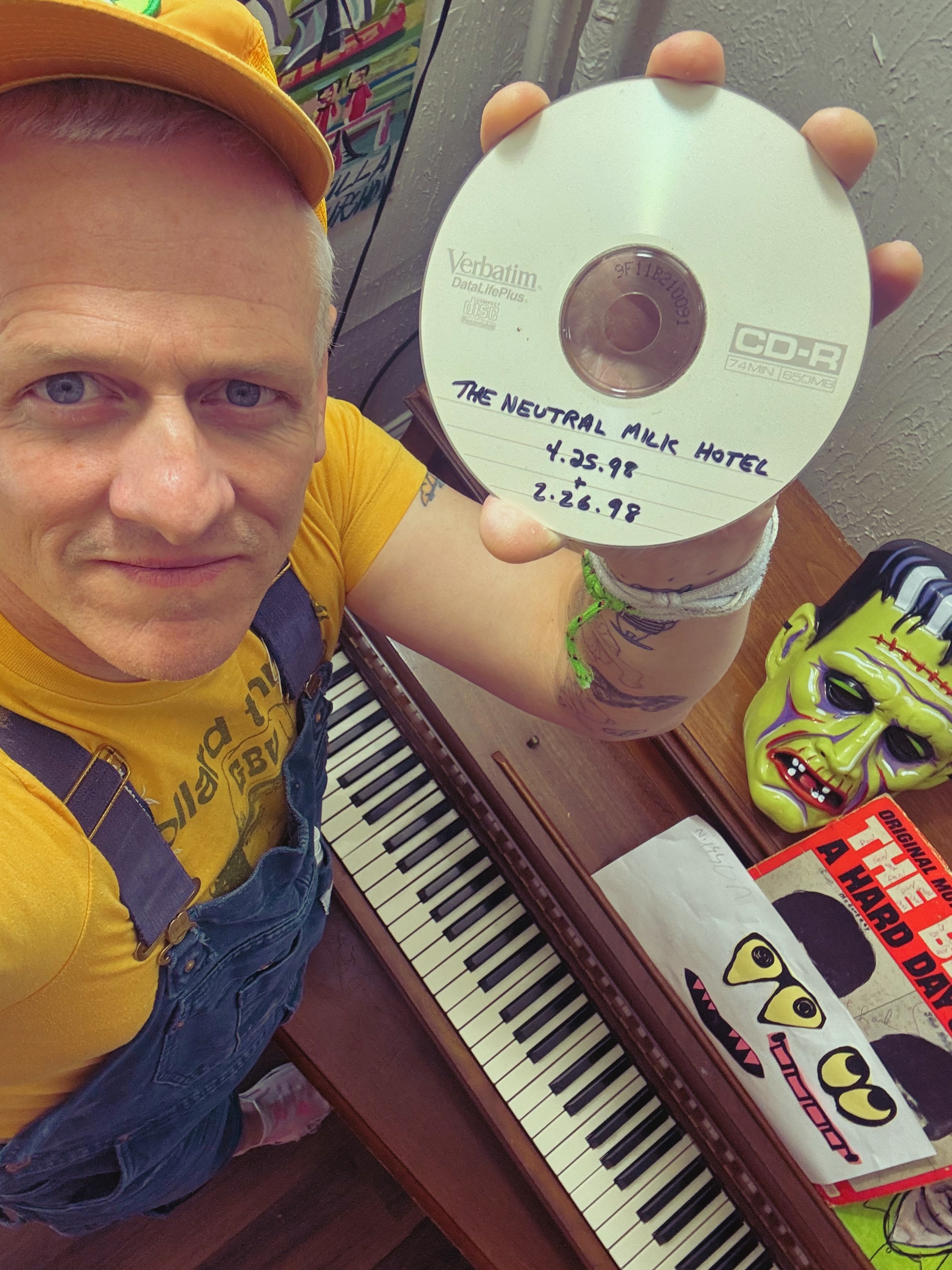 Patrick Tape Fleming holding a bootleg of a Neutral Milk Hotel concert
