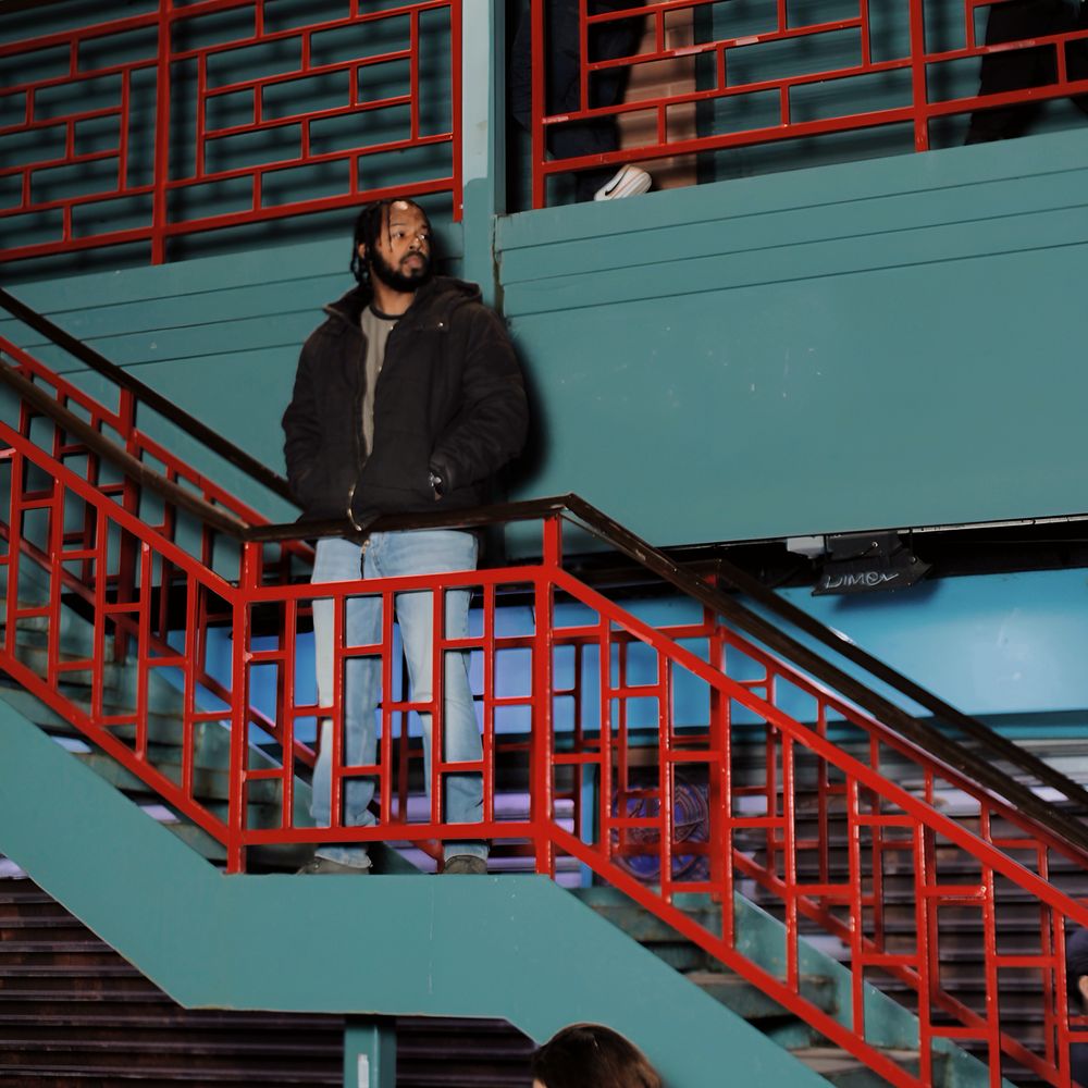 Jor, standing on stairs in Chinatown Chicago