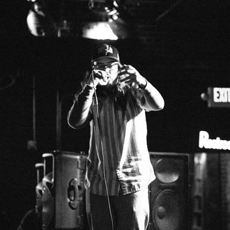 A photo of Symon Palmer talking on the microphone during a Billings show.