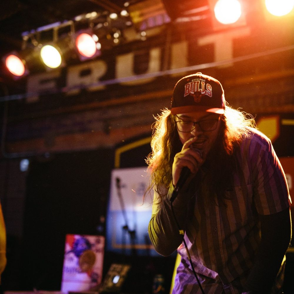 Symon Palmer rapping on the mic at the old Railyard venue in downtown Billings, MT.