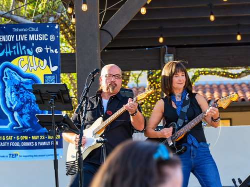 PretendAZ lead guitarist Robert Feeney and frontwoman Marty Novak performing live at Tohono Chul in Tucson, Arizona.
