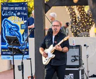 Robert Feeney playing lead guitar with PretendAZ at Tohono Chul's Chillin' at the Chul live music series in Tucson.
