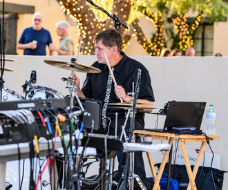 Adrian Rupp, PretendAZ drummer, performing live with the 80s rock and dance band.