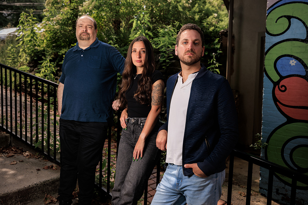 The Gary Randman Project — group promotional portrait by a railing