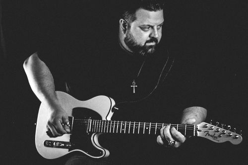 Pat James performing Playing Electric Guitar