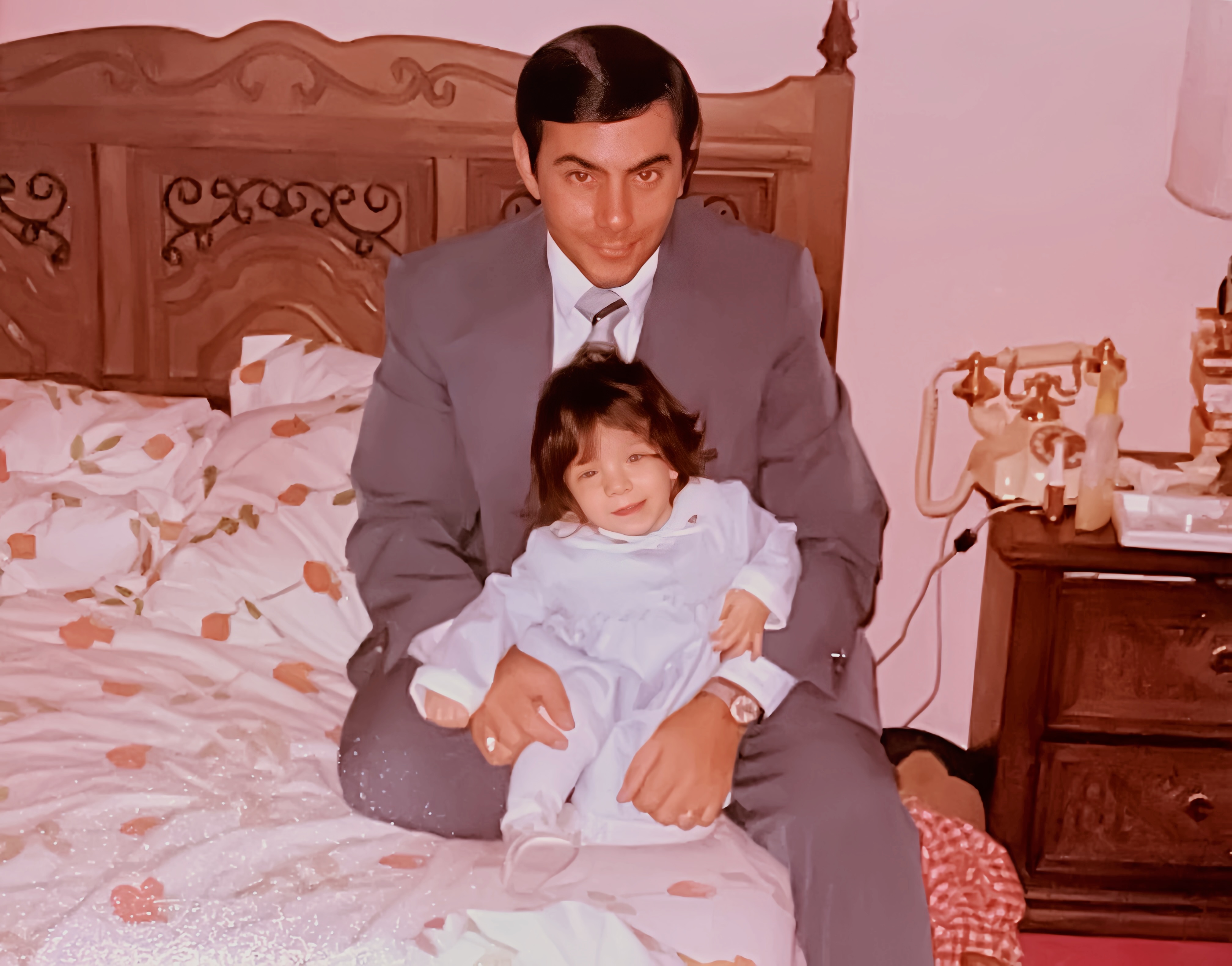 A photo from the late seventies of Laura as a toddler with her dad, Steve Sarkisian