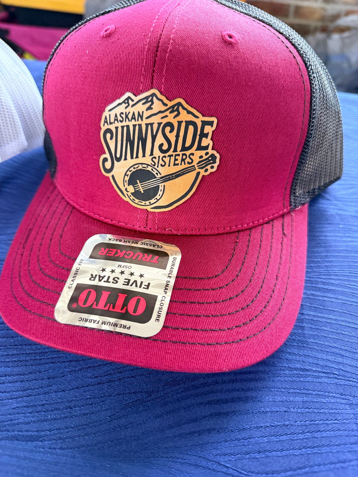 Alaskan Sunnyside Sisters Leather Patch Trucker Hat (Red/Charcoal or Navy/Gray)