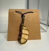 Orange Calcite wire-wrapped with black leather necklace
