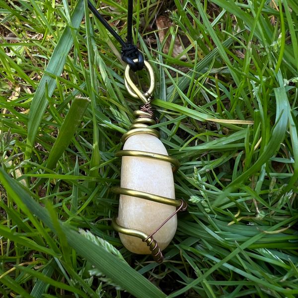 Orange Calcite wire-wrapped with black leather necklace