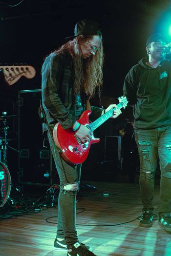 Stacey Hopkins, Guitar. Alex Peterson, Vocals.
