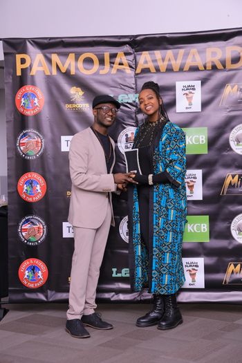 Macharia Receiving her Community Youth Champion Award 2025 from Derrick Kilori
