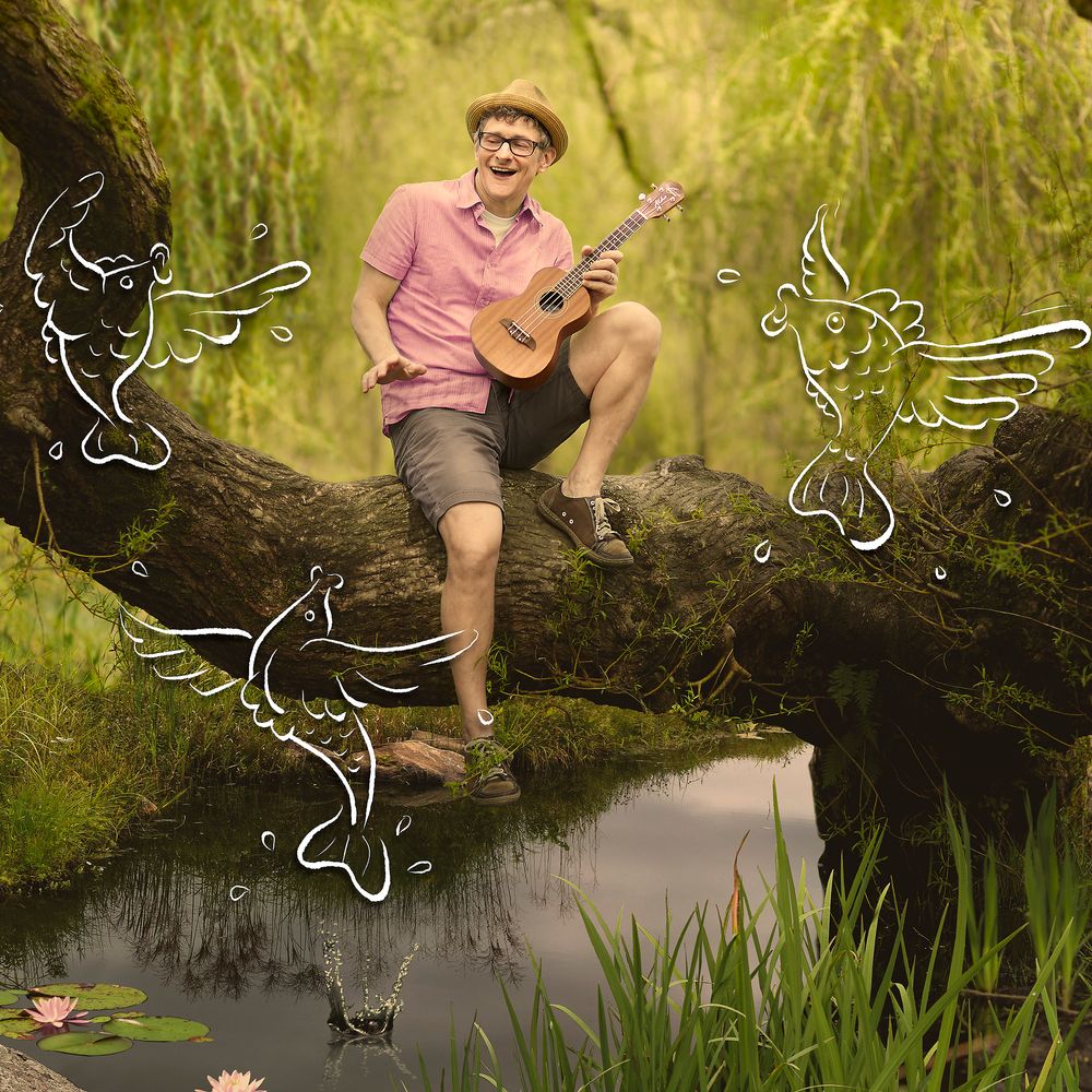 Man holding a miniature guitar with drawings of ducks splasing in mud