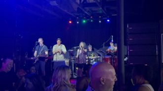 Packed crowd dancing to Funk Shui live party music at The Emporium nightlife venue in Brentwood California.