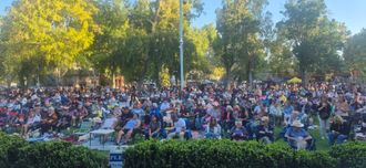 Massive crowd dancing to Funk Shui live funk and soul cover band at Concord's Music and Market event in Todos Santos Plaza, California.