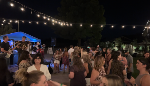 Funk Shui live party band engaging a massive outdoor crowd at a Campos Family Vineyards concert event in Byron California.